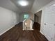 Hallway with hardwood floors, natural light, and several rooms in view at 4720 Fowler Cir, Acworth, GA 30101