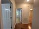 Hallway featuring hardwood floors and white doors leading to other rooms at 4720 Fowler Cir, Acworth, GA 30101