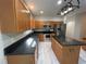 Well-lit kitchen featuring stainless steel appliances, granite countertops, and a functional center island at 4720 Fowler Cir, Acworth, GA 30101
