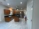 Spacious kitchen featuring granite countertops, stainless steel appliances, a functional island, and white tiled flooring at 4720 Fowler Cir, Acworth, GA 30101