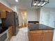 Open concept kitchen with stainless steel appliances, island, and breakfast bar at 4720 Fowler Cir, Acworth, GA 30101