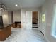 Bright kitchen featuring tile floors, stainless steel appliances, and granite countertops at 4720 Fowler Cir, Acworth, GA 30101