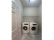 Laundry room featuring a side-by-side washer and dryer, with wire shelving above at 4720 Fowler Cir, Acworth, GA 30101