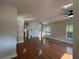 Spacious living room featuring gleaming hardwood floors and a modern ceiling fan at 4720 Fowler Cir, Acworth, GA 30101