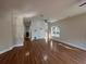 Spacious living room featuring hardwood floors, a ceiling fan, and large windows that provide plenty of natural light at 4720 Fowler Cir, Acworth, GA 30101