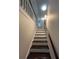 This shows a long staircase with wood steps and a white base leading upward at 4720 Fowler Cir, Acworth, GA 30101