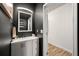 Modern bathroom with sleek vanity, ample storage, and stylish mirror at 4992 Lower Elm St, Atlanta, GA 30349