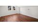Bright attic room featuring hardwood floors, white walls, trim and natural light from two windows at , Atlanta, GA 30344