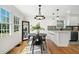 Sunlit dining area featuring modern table and chairs, with adjacent kitchen space at , Atlanta, GA 30344