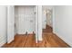 Functional laundry area with open shelving, perfect for storage, and hardwood flooring at , Atlanta, GA 30344