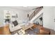 Bright living room with hardwood floors, a modern sofa, and seamless connection to the dining area at , Atlanta, GA 30344