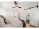 Spacious main bedroom with modern sliding door access to the bathroom and hardwood floors at , Atlanta, GA 30344