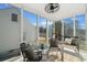 Enclosed sunroom with large windows, comfortable seating, and views of the outdoors at , Atlanta, GA 30344