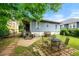 Backyard featuring a lawn, patio, and view of the home's exterior at 1639 Rogers Sw Ave, Atlanta, GA 30310