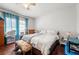 Bright bedroom with hardwood floors, large window, and neutral decor at 1639 Rogers Sw Ave, Atlanta, GA 30310