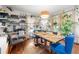 Bright dining room with hardwood floors, stylish light fixtures, and ample seating at 1639 Rogers Sw Ave, Atlanta, GA 30310