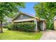 Charming bungalow with blue siding, covered front porch, and a well-maintained lawn at 1639 Rogers Sw Ave, Atlanta, GA 30310