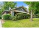 Charming bungalow with blue siding, covered front porch, and a well-maintained lawn at 1639 Rogers Sw Ave, Atlanta, GA 30310