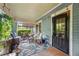 Inviting covered front porch with ample seating and stylish decor at 1639 Rogers Sw Ave, Atlanta, GA 30310