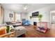 Bright living room with hardwood floors, fireplace, and large windows at 1639 Rogers Sw Ave, Atlanta, GA 30310