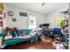 Modest living room featuring hardwood floors, couch, desk, and windows at 1639 Rogers Sw Ave, Atlanta, GA 30310