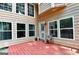 Outdoor deck with multiple windows offers a relaxing space with a chair and a view of the backyard at 4335 Burgomeister Pl, Snellville, GA 30039