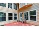Inviting back porch area with wood-cladded walls, access door, and a red painted deck at 4335 Burgomeister Pl, Snellville, GA 30039