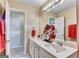 Functional bathroom boasts a double sink vanity, bright lighting, and clean fixtures for everyday convenience at 4335 Burgomeister Pl, Snellville, GA 30039