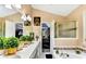 Bathroom with dual sinks, soaking tub, and luxurious decor at 4335 Burgomeister Pl, Snellville, GA 30039