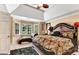 Bedroom with a bay window sitting area and decorative ceiling fan at 4335 Burgomeister Pl, Snellville, GA 30039