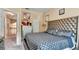 Bedroom with walk in closet, tufted headboard, and neutral walls at 4335 Burgomeister Pl, Snellville, GA 30039