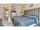 Inviting bedroom with tufted headboard, ensuite access, and abundant natural light at 4335 Burgomeister Pl, Snellville, GA 30039