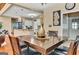 Open-concept dining room with hardwood floors and a view into the kitchen and other living spaces at 4335 Burgomeister Pl, Snellville, GA 30039