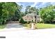 Stunning two-story home with lush landscaping and a spacious driveway, perfect for suburban living at 4335 Burgomeister Pl, Snellville, GA 30039