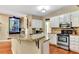 Updated kitchen featuring white cabinetry, stainless steel appliances, and granite countertops at 4335 Burgomeister Pl, Snellville, GA 30039