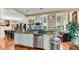 Open kitchen with granite countertops, white cabinets, stainless steel appliances, and a breakfast bar at 4335 Burgomeister Pl, Snellville, GA 30039