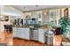 Open concept kitchen with granite countertops, stainless steel appliances, and hardwood floors at 4335 Burgomeister Pl, Snellville, GA 30039