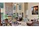 Comfortable living room featuring a stone fireplace, multiple windows, and plenty of seating at 4335 Burgomeister Pl, Snellville, GA 30039
