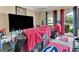 Bright living room boasts a large TV and recliners, ideal for comfortable viewing in a cheerful setting at 4335 Burgomeister Pl, Snellville, GA 30039