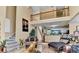 Open-concept living room showing stairs and a peek of the kitchen area at 4335 Burgomeister Pl, Snellville, GA 30039