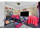 Cozy living room features a large TV, recliners, and sports-themed decor for a relaxing entertainment space at 4335 Burgomeister Pl, Snellville, GA 30039