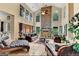 Bright open floor plan featuring a floor-to-ceiling fireplace, tile floors, and large windows at 4335 Burgomeister Pl, Snellville, GA 30039