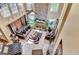 Bright living room with a stone fireplace, tile floors, and large windows that offer great natural light at 4335 Burgomeister Pl, Snellville, GA 30039
