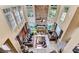 Overhead perspective of a living room with a stone fireplace and multiple windows at 4335 Burgomeister Pl, Snellville, GA 30039