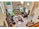 Bright living room with a stone fireplace, tile floors, and large windows that offer great natural light at 4335 Burgomeister Pl, Snellville, GA 30039