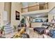 Inviting living room featuring stylish decor, tile floors, and an open floor plan leading to the kitchen at 4335 Burgomeister Pl, Snellville, GA 30039