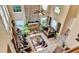 Aerial view of a well-appointed living room with stone fireplace, seating, and neutral colors at 4335 Burgomeister Pl, Snellville, GA 30039