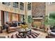 Grand living room showcases a stone fireplace, soaring windows, and classic decor for a luxurious feel at 4335 Burgomeister Pl, Snellville, GA 30039
