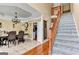 Traditional staircase leading to the upper level with hardwood floors and neutral walls at 4335 Burgomeister Pl, Snellville, GA 30039