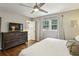 Comfortable bedroom with wood floors, dresser, and large windows for natural light at 687 Monticello Se Way, Marietta, GA 30067